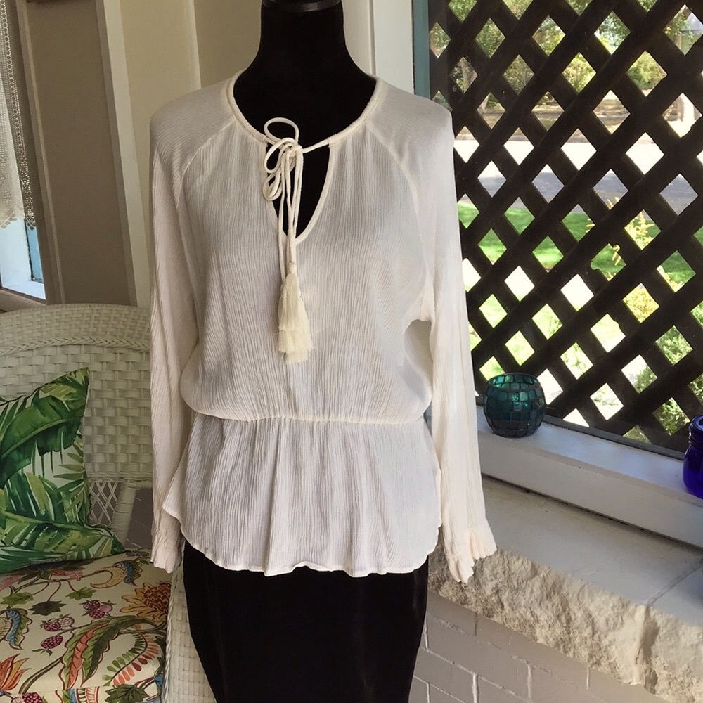 Lovey blouse with great drape appeal, gently worn.